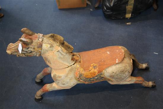An early 20th century carved and painted wood carousel horse, W.39in. H.27in.
